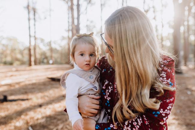 The-Pines-Family-Photographer-Perth-1-of-60 Mother holding her daughter during a Perth Family Photography session during Golden Hour at The Pines