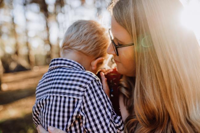 The-Pines-Family-Photographer-Perth-21-of-60 Little boy cuddling into his mother during a Perth Family Photography session during Golden Hour at The Pines