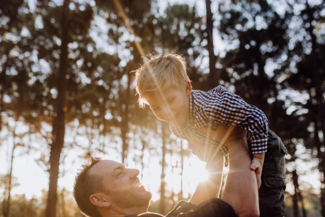 The-Pines-Family-Photographer-Perth-24-of-60 Father flying his little boy in the air during a Perth Family Photography session during Golden Hour at The Pines