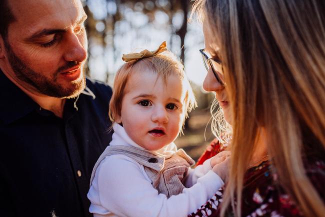 The-Pines-Family-Photographer-Perth-30-of-60 Parents holding their daughter during a Perth Family Photography session during Golden Hour at The Pines