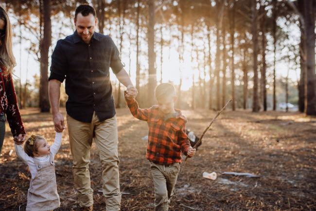 The-Pines-Family-Photographer-Perth-34-of-60 Father holding hands with his children during a Perth Family Photography session during Golden Hour at The Pines