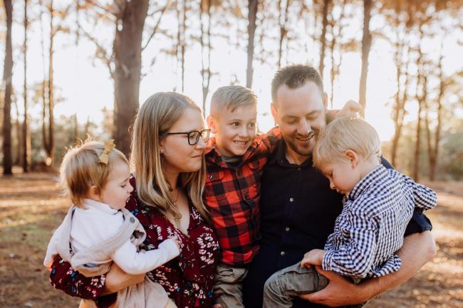 The-Pines-Family-Photographer-Perth-36-of-60 Parents holding their three kids during a Perth Family Photography session during Golden Hour at The Pines