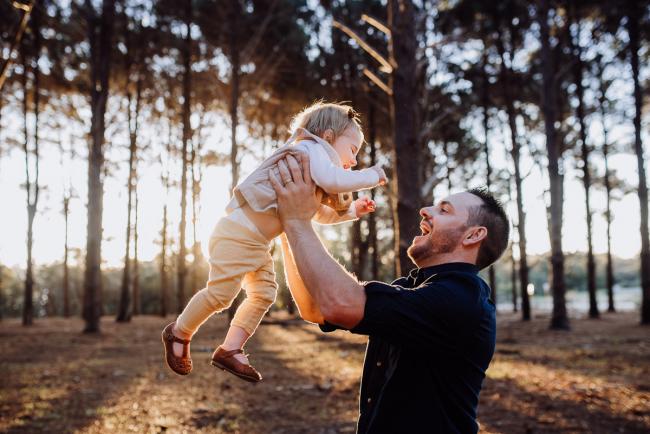 The-Pines-Family-Photographer-Perth-38-of-60 Father lifting his daughter in the air during a Perth Family Photography session during Golden Hour at The Pines