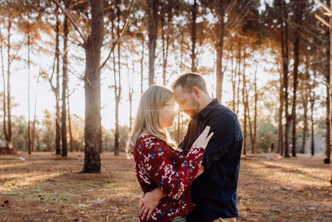 The-Pines-Family-Photographer-Perth-39-of-60 Couple touching foreheads during a Perth Family Photography session during Golden Hour at The Pines