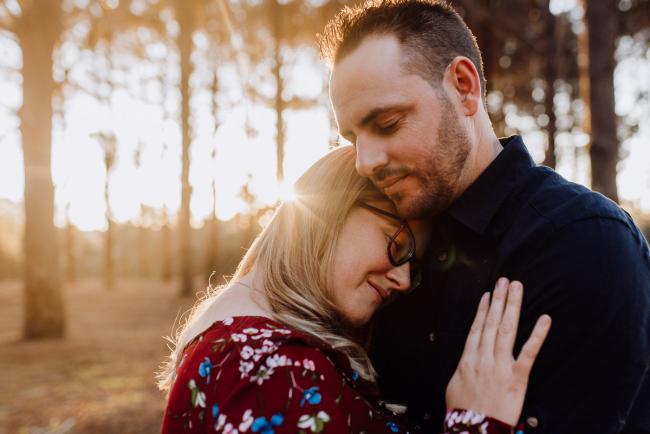 The-Pines-Family-Photographer-Perth-40-of-60 Woman leaning her head on her husband during a Perth Family Photography session during Golden Hour at The Pines
