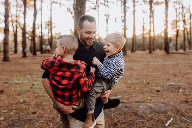 The-Pines-Family-Photographer-Perth-47-of-60 Father dancing with his boys during a Perth Family Photography session during Golden Hour at The Pines