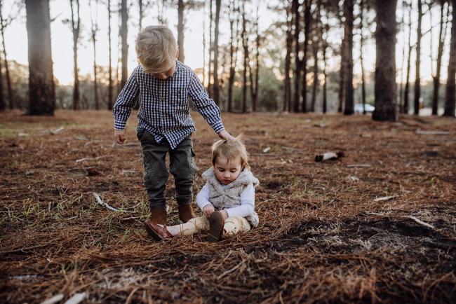 The-Pines-Family-Photographer-Perth-53-of-60 Little boy touching his little sister's head during a Perth Family Photography session during Golden Hour at The Pines