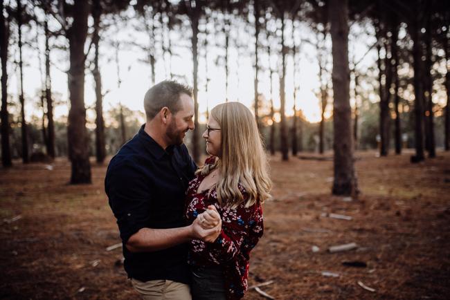 Couple dancing during a couple photography session in Perth during Golden hour at The Pines