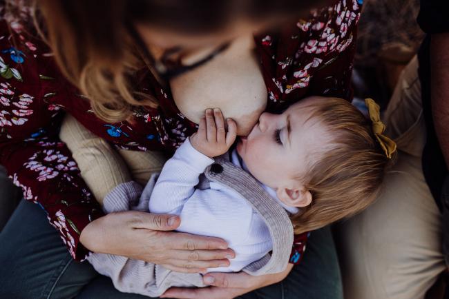 The-Pines-Family-Photographer-Perth-7-of-60 Little girl breastfeeding during a Perth Family Photography session during Golden Hour at The Pines