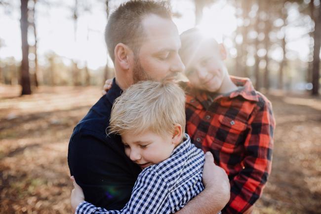 The-Pines-Family-Photographer-Perth-8-of-60 Father holding his two boys during a Perth Family Photography session during Golden Hour at The Pines