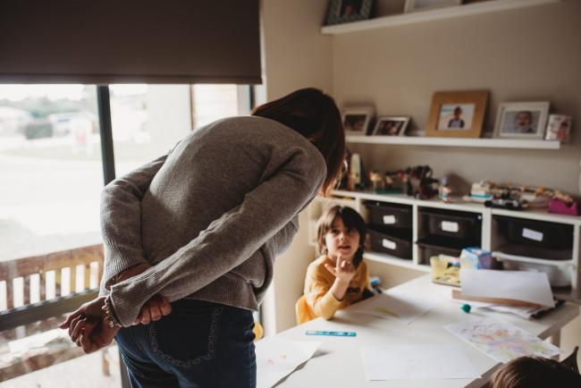 20190620-DSC_8057 Nanna leaning over talking to her grandson who is drawing at the table with Perth family photographer