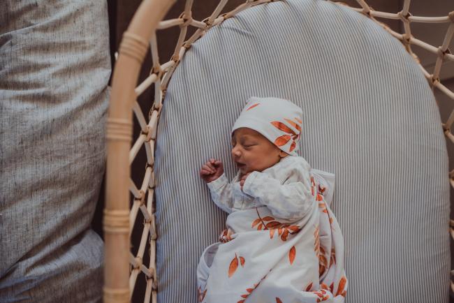 Baby in a cane bassinet during a Perth Fresh 48 photography session captured in home