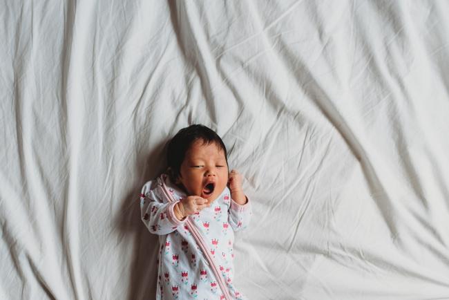 New baby yawning during an in-home Perth Newborn Lifestyle photography session