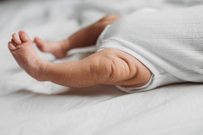 Close up of new baby's legs during an in-home Perth Newborn Lifestyle photography session