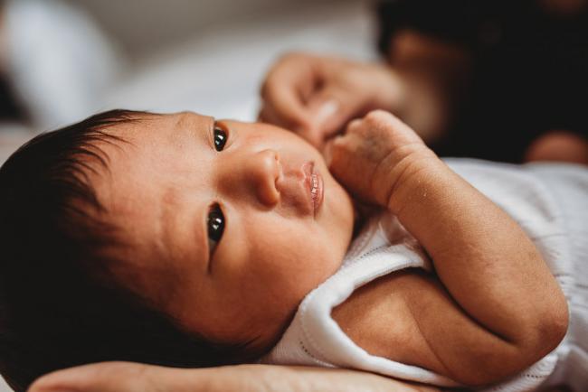 Close up of new baby face during an in-home Perth Newborn Lifestyle photography session