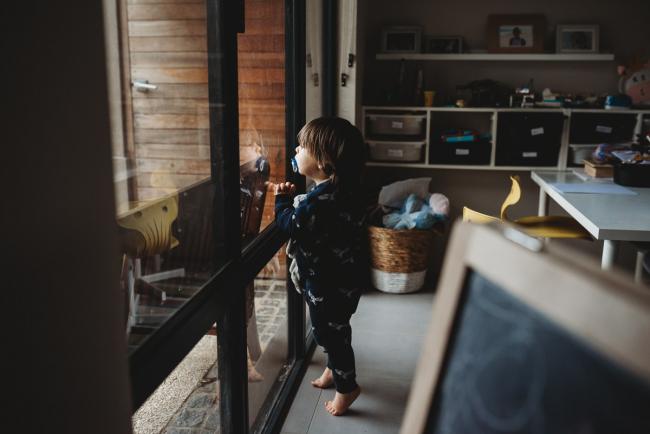 Perth-Family-Photographer-1-of-13 Little boy looking out the window with Perth family photographer