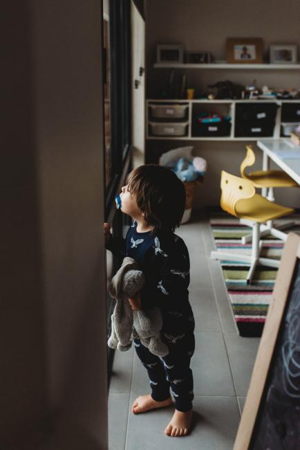 Perth-Family-Photographer-2-of-13 Little boy looking out the window with Perth family photographer