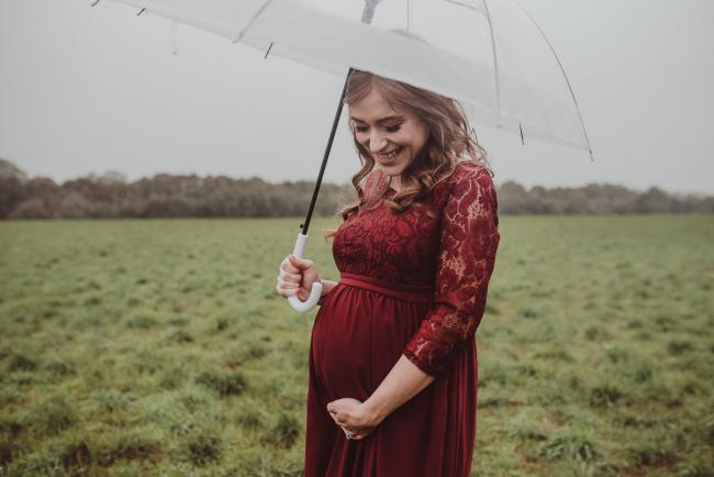 Perth-Maternity-Photographer-Perrys-Paddock-10-of-39 Pregnant lady with an umbrella during a Perth maternity session at Perry's Paddock during rain
