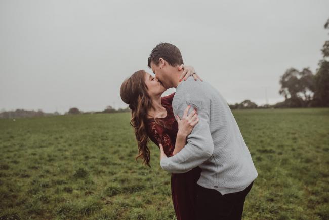 Perth-Maternity-Photographer-Perrys-Paddock-16-of-39 Pregnant couple kissing during a Perth maternity session at Perry's Paddock during rain