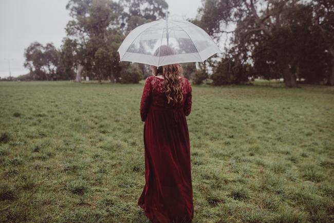 Perth-Maternity-Photographer-Perrys-Paddock-17-of-39 Pregnant lady walking away under an umbrella during a Perth maternity session at Perry's Paddock during rain