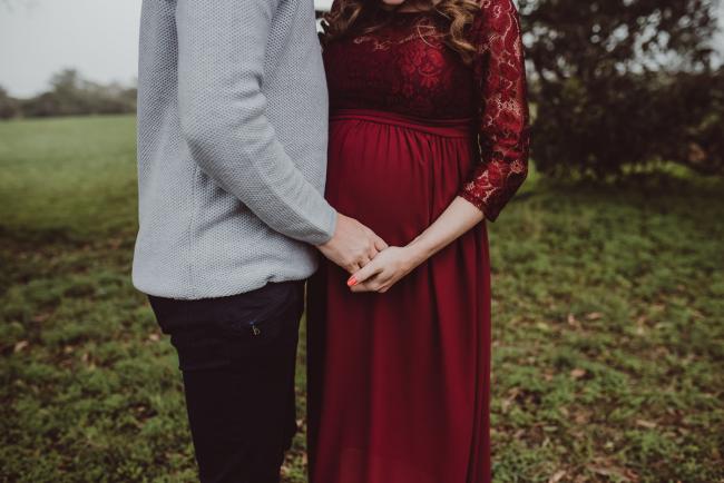 Perth-Maternity-Photographer-Perrys-Paddock-2-of-39 Couple holding hands over her baby bump during a Perth maternity session at Perry's Paddock during rain