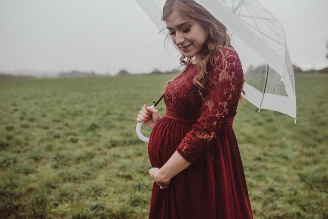 Perth-Maternity-Photographer-Perrys-Paddock-20-of-39 Pregnant lady under an umbrella during a Perth maternity session at Perry's Paddock during rain