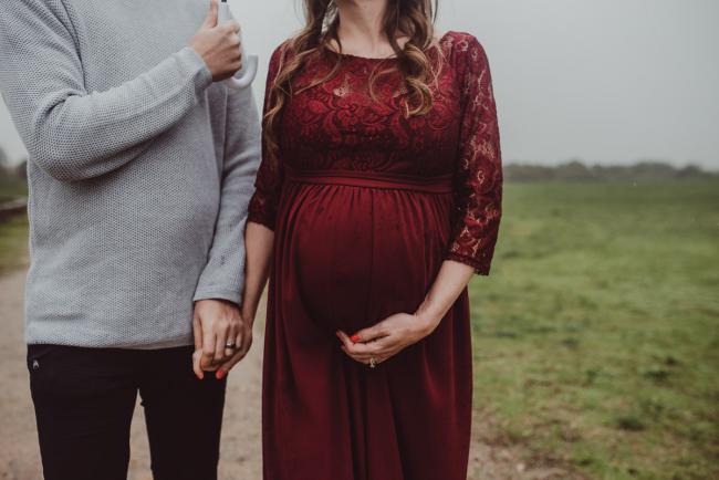 Close up of pregnant tummy with Perth maternity photographer at Perry's Paddock