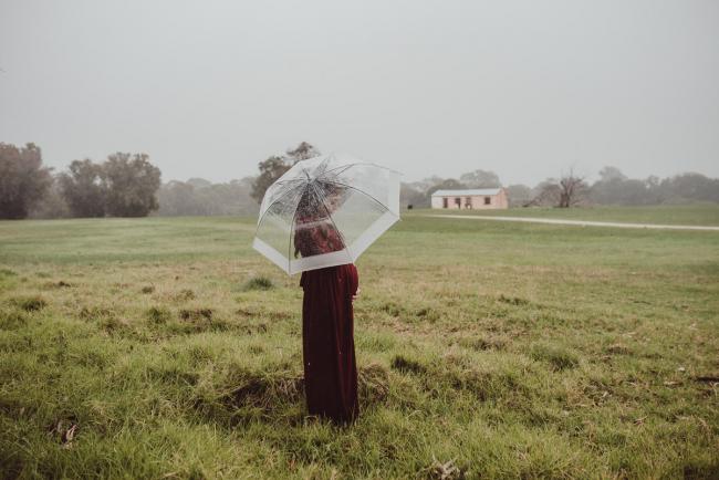 Perth-Maternity-Photographer-Perrys-Paddock-37-of-39 Pregnant lady standing under an umbrella during a Perth maternity session at Perry's Paddock during rain