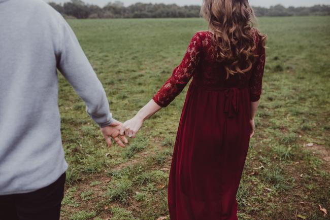 Couple holding hands with Perth couples photographer at Perry's Paddock
