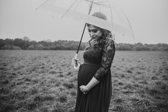 Perth-Maternity-Photographer-Perrys-Paddock-9-of-39 Black and white image of pregnant lady with an umbrella during a Perth maternity session at Perry's Paddock during rain