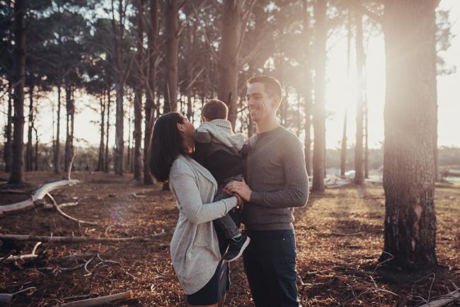 Perth-Maternity-Photographer-The-Pines-1-of-48 Mother and father standing holding little boy with Perth maternity photographer at The Pines