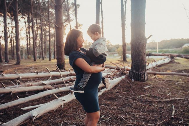 Perth-Maternity-Photographer-The-Pines-21-of-48 Pregnant woman holding her son with Perth maternity photographer at The Pines