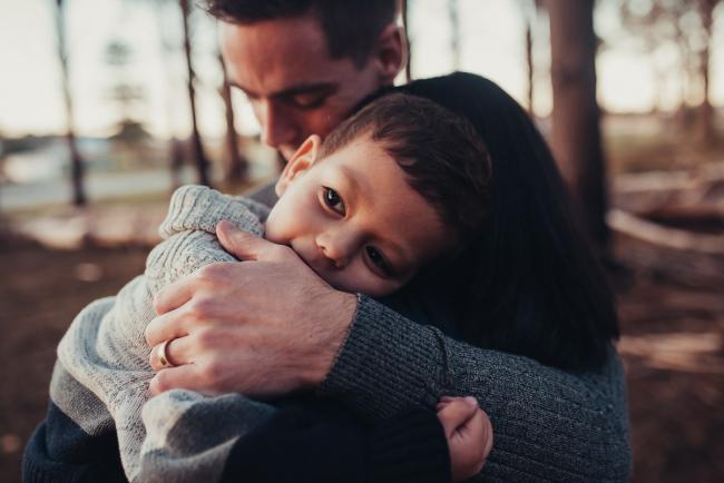 Perth-Maternity-Photographer-The-Pines-27-of-48 Little boy resting his head on his mother's shoulder with Perth maternity photographer at The Pines