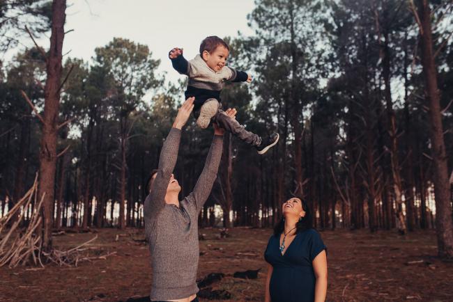 Perth-Maternity-Photographer-The-Pines-30-of-48 Father throwing son in the air with Perth maternity photographer at The Pines
