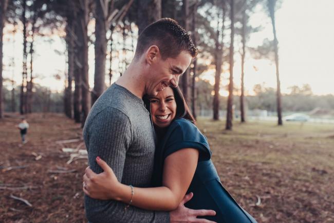 Perth-Maternity-Photographer-The-Pines-35-of-48 Pregnant couple hugging with Perth maternity photographer at The Pines