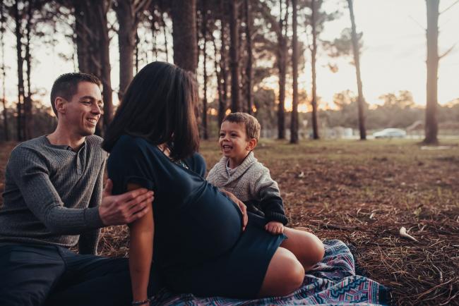 Perth-Maternity-Photographer-The-Pines-43-of-48 Family sitting on a rug with Perth maternity photographer at The Pines