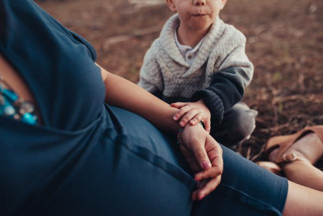 Perth-Maternity-Photographer-The-Pines-44-of-48 Little boy touching his mother's hand with Perth maternity photographer at The Pines