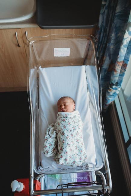 Top down image of new baby in bassinet during a Perth Fresh 48 photography session at SJOG Mt Lawley