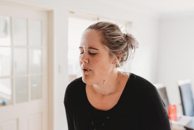 Pregnant woman breathing through a contraction with Perth Birth Photographer