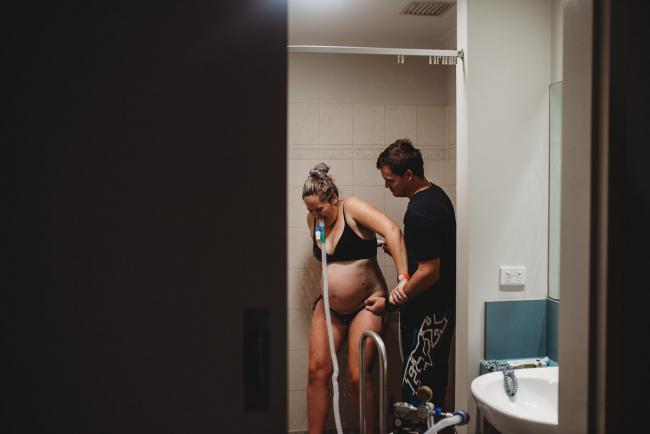 Pregnant woman during a contraction with Perth birth photographer at the Family Birthing Centre