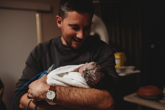 Birth-Photographer-Perth-1-of-60 Father holding newborn baby with Perth Birth Photographer at SJOG Mt Lawley