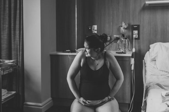 Birth-Photographer-Perth-11-of-60 black and white image of pregnant woman labouring on a fit ball with Perth Birth Photographer at SJOG Mt Lawley