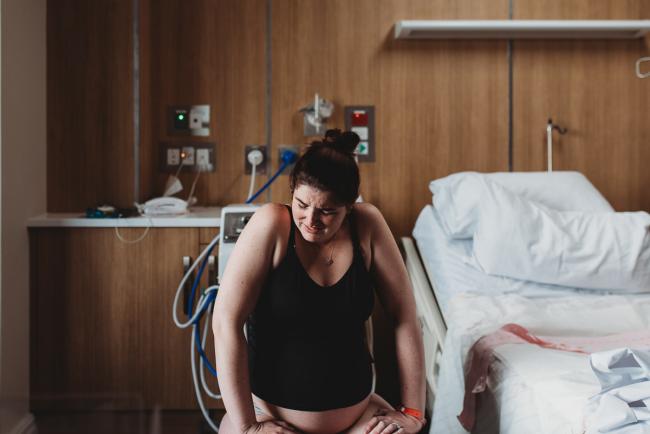 Birth-Photographer-Perth-12-of-60 Pregnant woman labouring on a fit ball with Perth Birth Photographer at SJOG Mt Lawley
