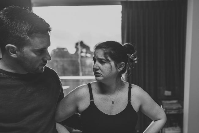 Birth-Photographer-Perth-29-of-60 Black and white image of labouring mother looking at her partner with Perth Birth Photographer at SJOG Mt Lawley