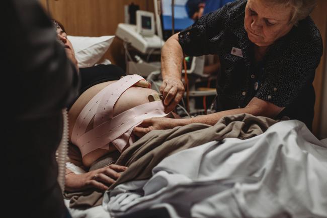 Birth-Photographer-Perth-42-of-60 Midwife putting heart rate monitor on pregnant mother with Perth Birth Photographer at SJOG Mt Lawley