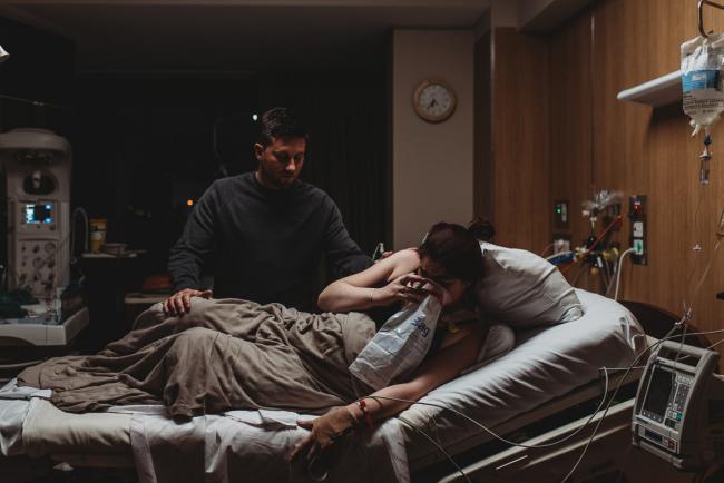 Birth-Photographer-Perth-47-of-60 Pregnant woman in hospital bed vomiting with Perth Birth Photographer at SJOG Mt Lawley