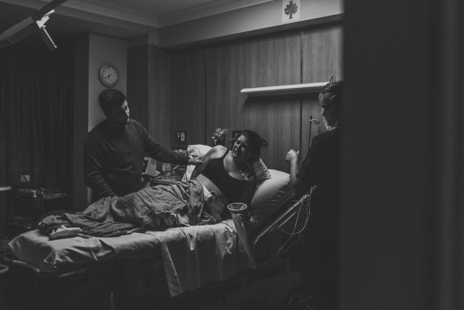 Birth-Photographer-Perth-48-of-60 Black and white image of pregnant woman in hospital bed with Perth Birth Photographer at SJOG Mt Lawley