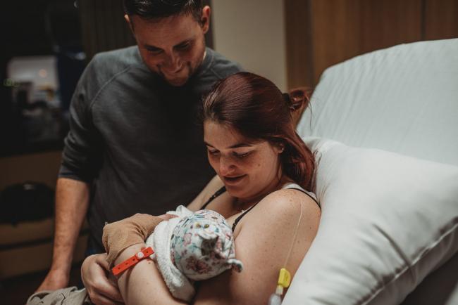 Birth-Photographer-Perth-5-of-60 Parents smiling down at their newborn baby with Perth Birth Photographer at SJOG Mt Lawley