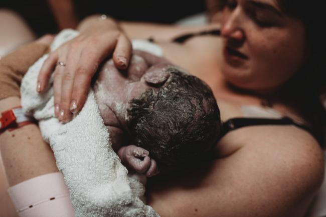 Birth-Photographer-Perth-58-of-60 Mother holding her newborn baby with Perth Birth Photographer at SJOG Mt Lawley