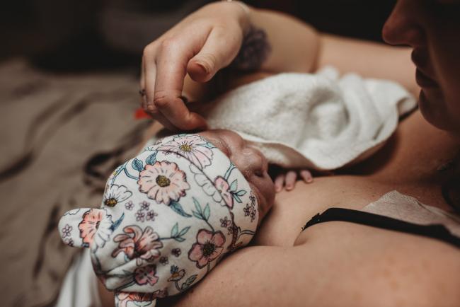 Birth-Photographer-Perth-6-of-60 Newborn baby with beanie being held by mum with Perth Birth Photographer at SJOG Mt Lawley